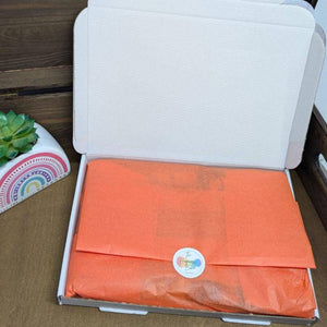 A Reese's Chocolate Letterbox Gift with various Reese's chocolate bars, beautifully packaged in a tissue-lined box.