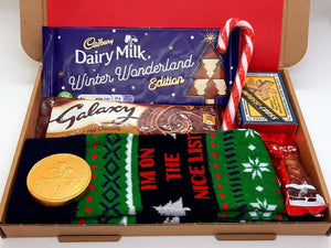 Men’s Christmas Letterbox Gift from The Happiness Box - festive chocolates, socks, and puzzle game in red tissue-lined box