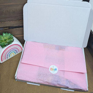 Pamper Letterbox Gift filled with skincare, chocolates, and candles.